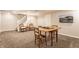 Finished basement features neutral carpet, stairs, and chess table at 6455 N Olney St, Indianapolis, IN 46220