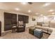 Finished basement with neutral carpet, sectional, and home theatre at 6455 N Olney St, Indianapolis, IN 46220