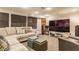 Finished basement includes a sectional, speakers, and large screen tv at 6455 N Olney St, Indianapolis, IN 46220