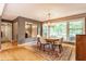 Elegant dining room with a wood table, chandelier, and large windows at 6455 N Olney St, Indianapolis, IN 46220