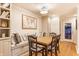 Charming dining area featuring a built-in bench with decorative pillows and a classic wooden table with seating for four at 6455 N Olney St, Indianapolis, IN 46220