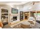 Bright living room boasting a fireplace, skylight, and open layout at 6455 N Olney St, Indianapolis, IN 46220