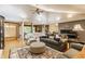 Open concept living room featuring hardwood floors, a fireplace, and stylish furniture at 6455 N Olney St, Indianapolis, IN 46220