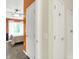 Hallway view to a bedroom with great natural light and ensuite bath with shower-tub combination at 6518 Jade Stream Ct # 312, Indianapolis, IN 46237