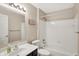 Bright bathroom featuring shower-tub combo, modern sink and vanity at 6518 Jade Stream Ct # 312, Indianapolis, IN 46237