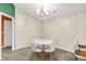 Dining room featuring modern light fixture and seating for four at 6518 Jade Stream Ct # 312, Indianapolis, IN 46237