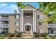Charming condo with classic architectural design and beautiful landscaping with colorful flowerbeds at 6518 Jade Stream Ct # 312, Indianapolis, IN 46237