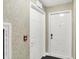 Hallway view with fire safety equipment and secure door entry to individual unit at 6518 Jade Stream Ct # 312, Indianapolis, IN 46237