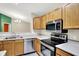 Bright and efficient kitchen with stainless steel appliances and ample counter space at 6518 Jade Stream Ct # 312, Indianapolis, IN 46237