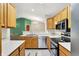 Well-lit kitchen featuring stainless steel appliances and plenty of counter space at 6518 Jade Stream Ct # 312, Indianapolis, IN 46237