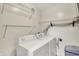 Functional laundry room with washer, dryer, and shelving at 6518 Jade Stream Ct # 312, Indianapolis, IN 46237