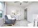 Bright Bedroom features gray rocking chair, round mirror and a white dresser at 6841 Seabiscuit Rd, Whitestown, IN 46075