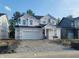 New two-story home featuring a two-car garage and covered entry awaiting final exterior finishes at 6841 Seabiscuit Rd, Whitestown, IN 46075