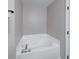 Bathroom featuring white tiled bathtub with faucet and tiled surround at 705 Treyburn Lakes Way, Indianapolis, IN 46239