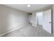 Cozy bedroom with light-colored carpet and access to closet and another room at 705 Treyburn Lakes Way, Indianapolis, IN 46239