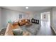 Comfortable living room featuring neutral walls, contemporary furnishings, hardwood floors, and recessed lighting at 705 Treyburn Lakes Way, Indianapolis, IN 46239