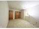 Bright bedroom featuring neutral carpeting, patterned wallpaper, a window, and built-in closets for storage at 7115 Fremont Ct, Indianapolis, IN 46256