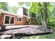 Back exterior view featuring a brick home, large patio area, and well-maintained landscaping for outdoor entertaining at 7115 Fremont Ct, Indianapolis, IN 46256