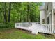 Enjoy the serene backyard views from the spacious white deck with ample seating and lush greenery surrounding it at 7138 Nile Ridge Ct, Indianapolis, IN 46236