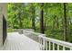 Expansive backyard deck with a lovely view of the verdant trees, perfect for relaxation or entertaining guests at 7138 Nile Ridge Ct, Indianapolis, IN 46236