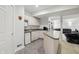 This finished basement offers a convenient kitchenette with white cabinets and appliances at 7138 Nile Ridge Ct, Indianapolis, IN 46236