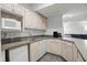 The basement's kitchenette offers modern appliances and plenty of counter space at 7138 Nile Ridge Ct, Indianapolis, IN 46236