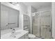 A well-lit bathroom featuring a sink, toilet, and shower stall at 7138 Nile Ridge Ct, Indianapolis, IN 46236