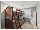 This gray toned bedroom features a bunk bed with a window and built in shelving at 7138 Nile Ridge Ct, Indianapolis, IN 46236