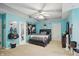 A serene bedroom featuring natural light, ceiling fan, and a neutral color scheme at 7138 Nile Ridge Ct, Indianapolis, IN 46236