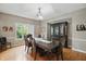 This dining room features hardwood floors, a chandelier and a dark wood china cabinet at 7138 Nile Ridge Ct, Indianapolis, IN 46236