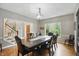 Formal dining room with wood floors, large table and chairs, and a view to the staircase at 7138 Nile Ridge Ct, Indianapolis, IN 46236