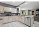Beautiful kitchen showcasing stainless steel appliances, ample cabinet space, and easy access to the adjacent living area at 7138 Nile Ridge Ct, Indianapolis, IN 46236