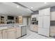 Well-lit kitchen offering ample counter space, a large refrigerator, and seamless integration with the adjacent living spaces at 7138 Nile Ridge Ct, Indianapolis, IN 46236