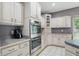 Kitchen with white cabinets, modern appliances, and contrasting countertops at 7138 Nile Ridge Ct, Indianapolis, IN 46236