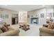 Living room featuring neutral walls, carpeted floors, and a fireplace with views of the staircase at 7138 Nile Ridge Ct, Indianapolis, IN 46236