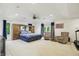 Expansive primary suite with a king bed, built-in cabinets, and natural light creating a comfortable private retreat at 7138 Nile Ridge Ct, Indianapolis, IN 46236