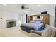 Large primary bedroom offering a fireplace, a comfortable bed, and stylish furnishings for a serene and restful atmosphere at 7138 Nile Ridge Ct, Indianapolis, IN 46236