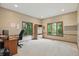 Bright office space featuring carpeted floors, neutral walls, and multiple windows for natural light at 7138 Nile Ridge Ct, Indianapolis, IN 46236