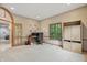 Office with neutral walls, carpeted floors, a built-in cabinet, and a view into the living room at 7138 Nile Ridge Ct, Indianapolis, IN 46236