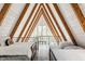 Upstairs bedroom features three beds and natural light from a large window at 7207 Grouper Dr, Nineveh, IN 46164