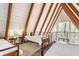 Spacious bedroom showing beds with wood beams, and white shiplap at 7207 Grouper Dr, Nineveh, IN 46164