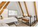 Bedroom with wood beams, white shiplap, and three twin beds at 7207 Grouper Dr, Nineveh, IN 46164
