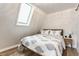 A quaint bedroom with a skylight and charming decor at 7207 Grouper Dr, Nineveh, IN 46164