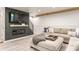 Comfortable living room with a fireplace and flatscreen TV above, next to a cozy sectional sofa and wood flooring at 7207 Grouper Dr, Nineveh, IN 46164