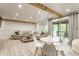 Bright living room featuring a comfortable sectional sofa, wood floors, and access to an outdoor patio at 7207 Grouper Dr, Nineveh, IN 46164