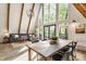 Bright and airy living room featuring a large window, dining area, and comfortable sofa at 7207 Grouper Dr, Nineveh, IN 46164