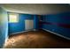 A blue bedroom offers a blank canvas with natural light through a window at 721 Haugh St, Indianapolis, IN 46222