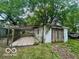 View of backyard garage and chained enclosure in spacious backyard area at 721 Haugh St, Indianapolis, IN 46222