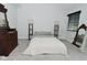This bedroom includes plush carpeting and a decorative mirror at 7529 Oceanline Dr, Indianapolis, IN 46214