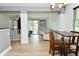 View from dining area into the living room with sliding glass doors to outdoor deck at 7529 Oceanline Dr, Indianapolis, IN 46214